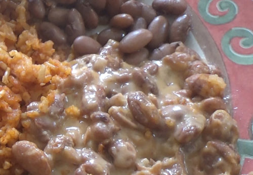 Beans with cheese, and beans without cheese and some rice.